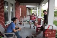 Jamie Long, Ben Trumbo, Tim Brady in a front porch meeting, complete with brews and dogs